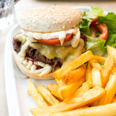 Cheese burger - American cheese burger with fresh salad