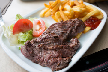 juicy steak beef meat with tomato and french fries