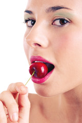 Close up portrait of beautiful young woman with cherry 