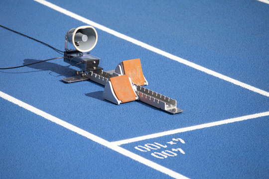 Start block of sprinters and loudspeaker