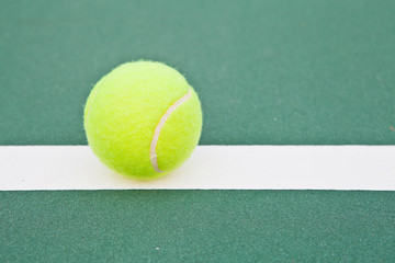 Tennis court at base line with ball