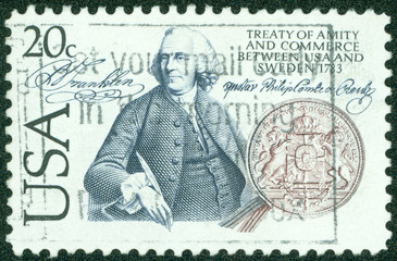 stamp  shows Benjamin Franklin and seal