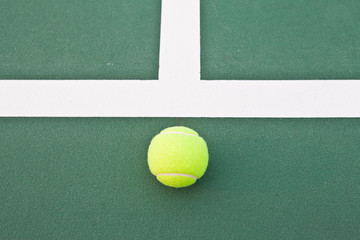 Tennis court at base line with ball