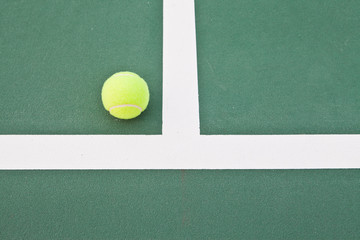 Tennis court at base line with ball