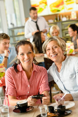 Fototapeta premium Mother and daughter relaxing in a cafe