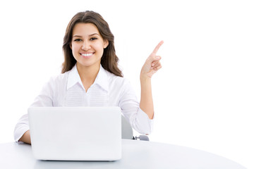 Young business woman pointing at corner