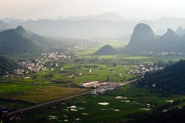 Foto op Canvas Aerial view Guilin village at sunset from Moon Hill mountain © petunyia