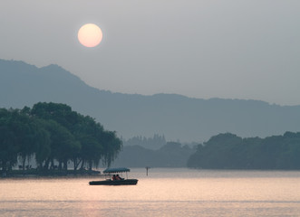 Tele image of Xihu Lake at sunset.