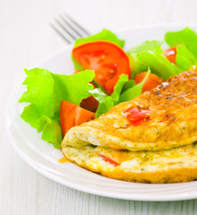 Omelet with vegetable salad