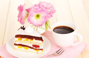 Layered fruit cake on wooden table