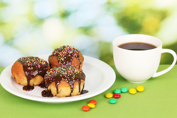 Appetizing cupcakes with chocolate on nature background