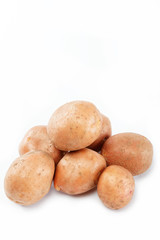 Fresh potatoes on a white background