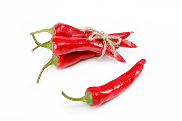 Red hot chili peppers tied with rope isolated on white