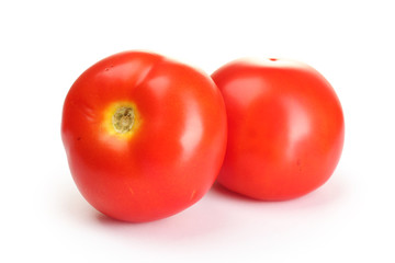 Ripe red tomatoes isolated on white