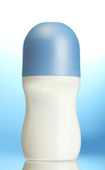 deodorant on blue background