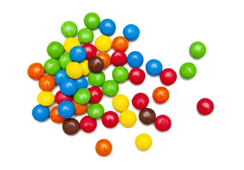 Gordijnen Colorful candies isolated on white background © Liaurinko