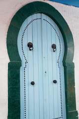 Blue door in the traditional tunisian architecture of the medina