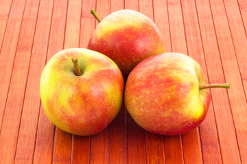apples on wooded background
