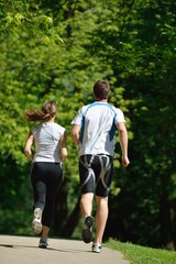 Fototapeta premium Young couple jogging at morning