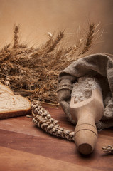  Rolls, bread and flour on wooden table
