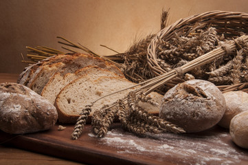  Rolls, bread and flour on wooden table