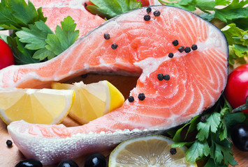 raw salmon steak with vegetables