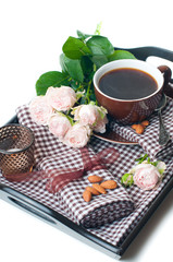 coffee and roses on a tray