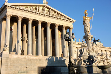 Fototapeta premium The Austrian Parliament and Athena Fountain in Vienna, Austria