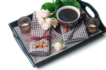 coffee and roses on a tray