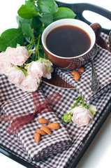 coffee and roses on a tray