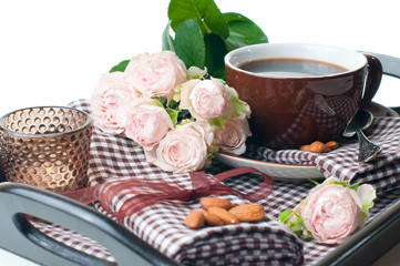 coffee and roses on a tray