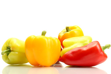 fresh yellow, red and green bell peppers isolated on white