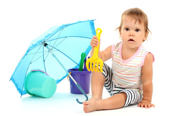 Cute baby with bucket and spade near umbrella isolated on white