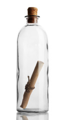 Glass bottle with note inside isolated on white