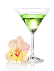 glass with cocktail and gladiolus bud isolated on white