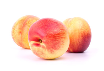 Three nectarines isolated on white background