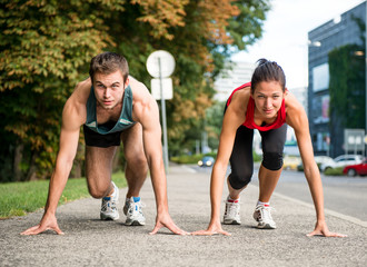 Rivalry - young couple competing in running