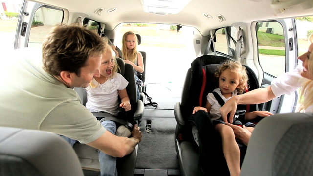Young Daughters and Parents in Car Shopping Trip