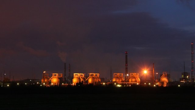 Phosphoric factory is shine by lanterns against night sky