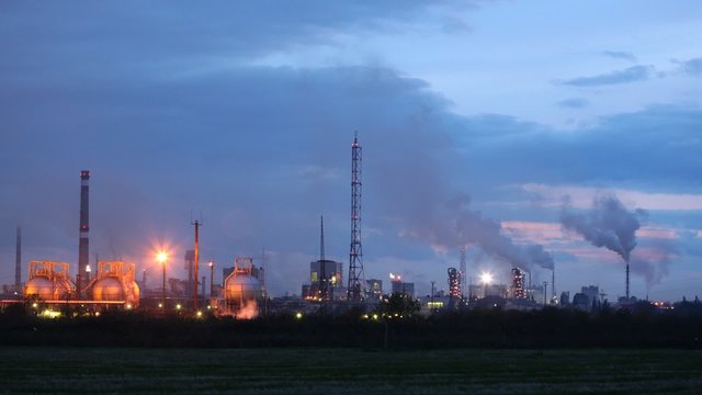Chimney shaft of phosphoric factory stand against sky