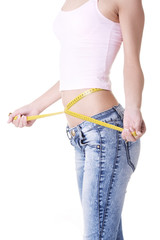 Woman measuring her waist