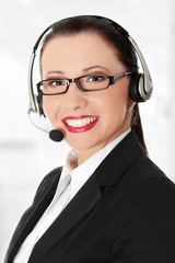 Smiling young woman with headset and microphone.