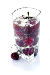 Sweet cherry in glass with water