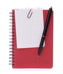 Red notebook with notice paper and pen