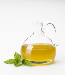 bottle with olive oil and basil