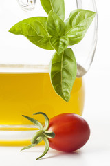 bottle with olive oil tomato cherry and basil