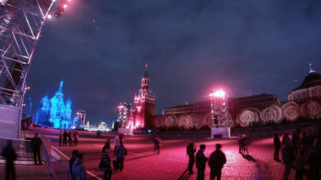 People walk on Red Square at night