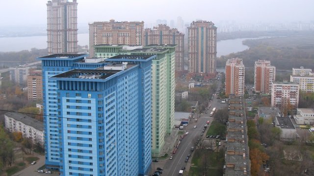 Skyscrapers stand in front of housing estate