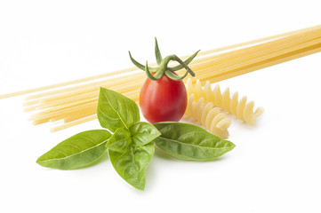 spaghetti with tomato cherry and basil on white background
