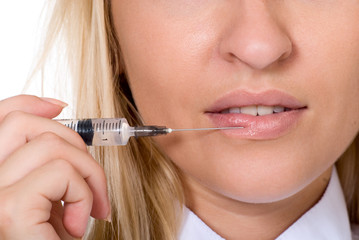 Beautiful woman recieving a injection in her lip